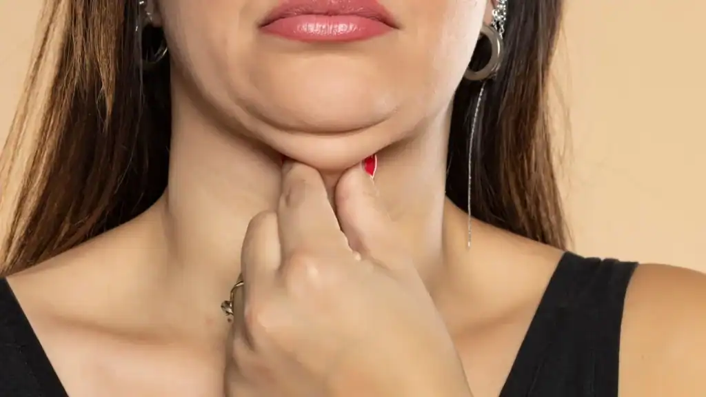 An image of a woman with double chin, sad, worried : Non Surgical Double Chin Removal Treatment in Houghton Regis, UK